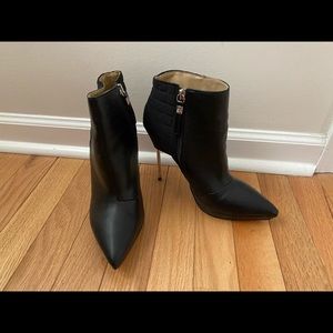 gx by Gwen Stefani size 7.5, black with silver metal heel.